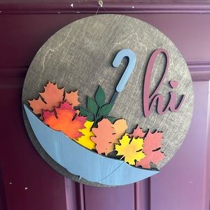 Come get this cute, handmade “Hi Fall” front door sign.